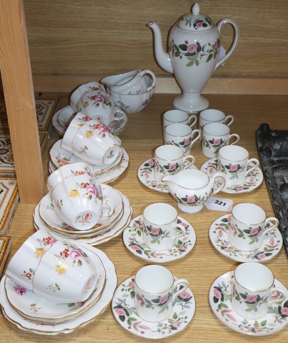 A Royal Crown Derby Derby Posies 25-piece part tea service and a Wedgwood Hathaway Rose part coffee service,